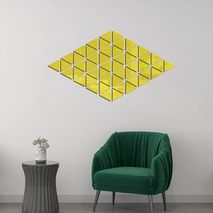 Detail showing the reflective yellow triangle mirror wall stickers in a modern living room