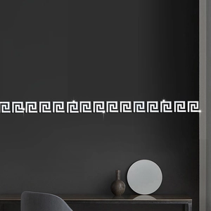 Macro detail of silver acrylic mirror wall stickers with geometric Greek meander pattern