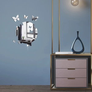 Detail of creative butterfly acrylic mirror wall stickers with a large circular center piece