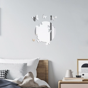 Macro detail of acrylic butterfly mirror wall stickers on a modern bedroom background