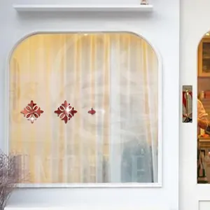 Red mirror acrylic floral wall decals with symmetric hollow patterns for home decoration