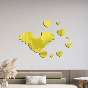 Macro detail of yellow acrylic mirror wall stickers with 3D heart and angel wings
