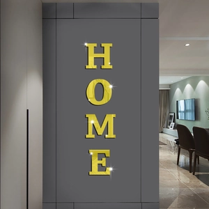 Adesivi murali HOME con finitura a specchio dorata su sfondo grigio scuro