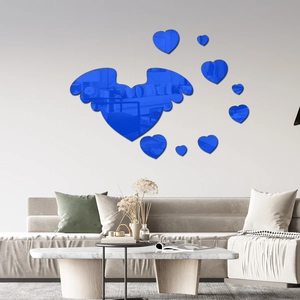Blue 3D acrylic mirror wall stickers with wings and hearts in a modern living room