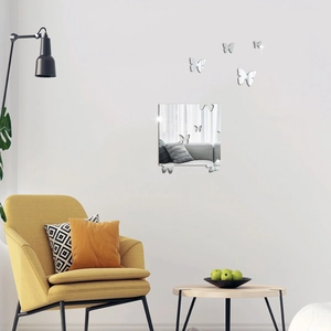 Stickers muraux papillons miroir argentés pour la décoration d'un salon moderne