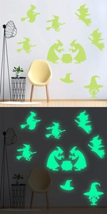 Luminous Halloween wall stickers showing witch on broom in both daylight and green glow