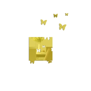 Détail de stickers muraux papillon miroir dorés avec surface réfléchissante brillante