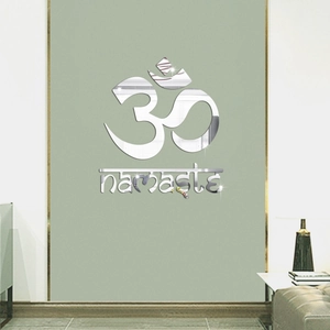 Close-up of 3D silver mirror acrylic wall sticker featuring Om symbol and Namaste text