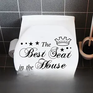 Detail showing 'The Best Seat in the House' waterproof vinyl sticker on a white toilet lid