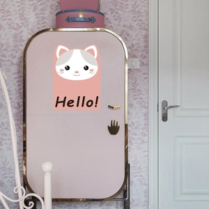 Cute pink cat cartoon mini fridge with Hello text and gold trim in a bedroom