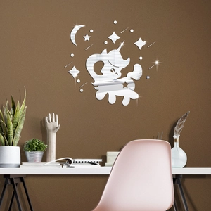 Detail of silver unicorn and moon mirror wall decals on a modern office room wall