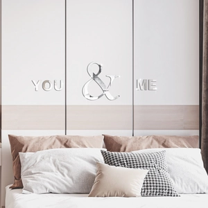 Close-up of YOU & ME 3D acrylic mirror wall sticker with reflective silver finish for bedroom