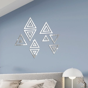 Modern geometric silver mirror triangle wall stickers arranged on a blue bedroom wall
