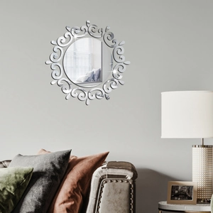 Detail of sunflower acrylic wall mirror with elegant scrollwork pattern on gray wall
