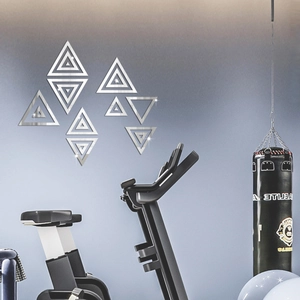 Silver triangle mirror wall stickers decorating a modern gym background wall