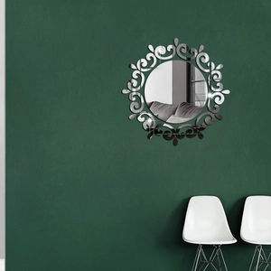 Detail of silver acrylic sunflower mirror wall sticker on a dark green background