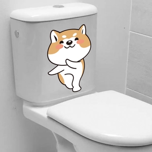 Close-up of a cute cartoon Shiba Inu decorative waterproof sticker on a white ceramic toilet