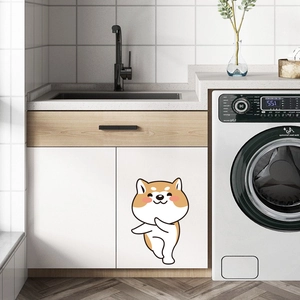 Funny cartoon Shiba Inu dog wall sticker applied on a white modern cabinet in laundry room