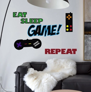 Detail showing self-adhesive game controller wall stickers in a modern living room