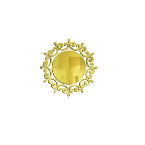 Detail of golden acrylic sunburst mirror wall sticker with ornate scroll pattern
