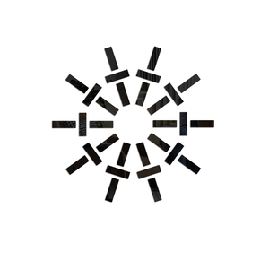 Detail of DIY mirror wall decals arranged in a geometric sunburst pattern on white backdrop
