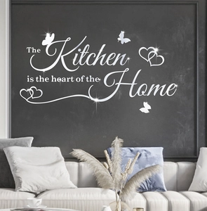Macro detail of silver acrylic mirror wall decal with kitchen quote and heart motifs