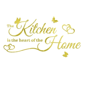 Detail of gold mirror acrylic wall decal with 'The Kitchen is the heart of the Home' text