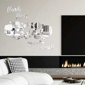 Close-up of acrylic mirror wall stickers with lifestyle words and round disc patterns