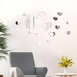 Detail of multi-size heart mirror wall stickers with reflective surface in a modern living room