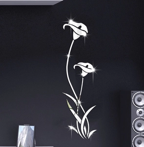 Detail of silver mirror acrylic calla lily 3D wall stickers on a dark modern living wall