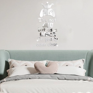 Detail of silver mirror acrylic gaming controller wall sticker with gamer quote