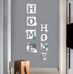 Close-up of 3D acrylic mirror wall stickers featuring HOME letters for living room decor