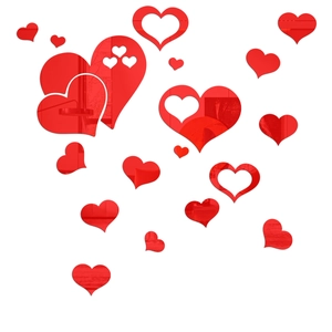 Macro view of red 3D mirror heart wall stickers showing glossy acrylic reflective finish