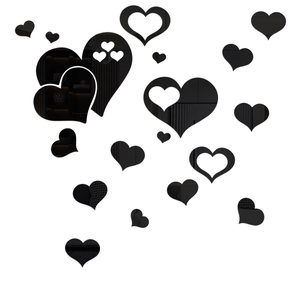 Detailed view of black 3D heart mirror wall stickers with glossy reflective acrylic finish