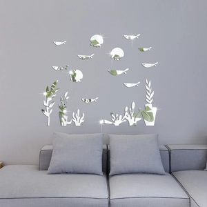 Detailed mirror acrylic sea fish wall stickers reflecting light on a modern gray living room wall