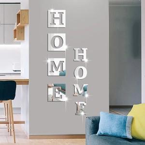 Detail view of 3D acrylic mirror wall stickers spelling HOME in silver finish