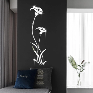 Detail of 3D silver mirror acrylic calla lily wall stickers on a dark gray living room wall