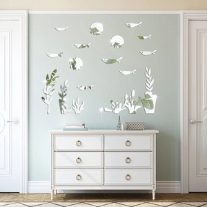 Macro detail of acrylic 3D mirror wall stickers with sea fish and coral reef shapes