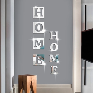 Detailed view of silver acrylic mirror wall stickers featuring HOME letters on grey wall