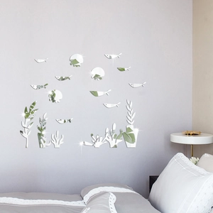 Detailed mirror-finish acrylic fish and coral wall decals on a bedroom headboard