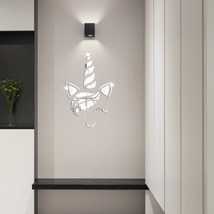 Close-up of unicorn mirror wall sticker set on a gray wall for kid room decoration