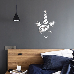 Detailed close-up of a 3D unicorn acrylic mirror wall sticker on a bedroom wall