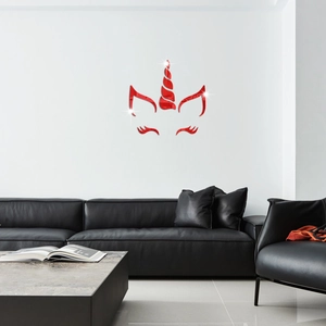 Detailed view of red mirror acrylic unicorn wall stickers above a black leather sofa