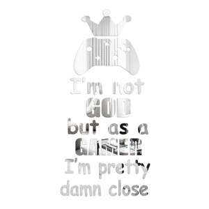 Macro detail of silver acrylic mirror wall decal with crown and game controller