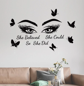 Creative eye wall decal with butterflies and 'She Believed She Could' quote for living room