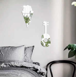 Detailed view of ice cream and guitar shaped acrylic mirror wall stickers on a bedroom wall