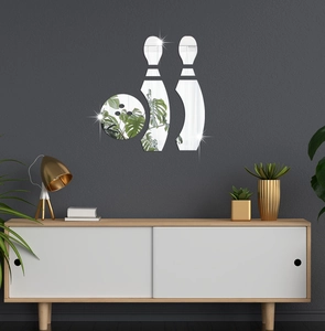 Detail view of bowling mirror wall stickers on a textured grey wall in a modern living room