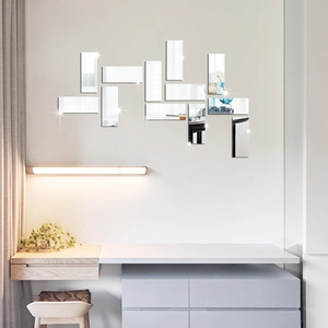 Detailed view of 12pcs self-adhesive mirror acrylic wall strips in a modern living room