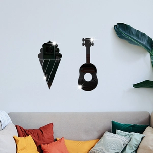 Detailed view of black acrylic ice cream and guitar mirror wall stickers on a grey wall