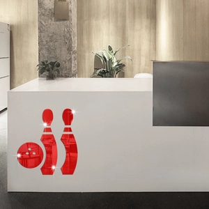 Detail of red acrylic bowling mirror wall stickers on a modern office front desk